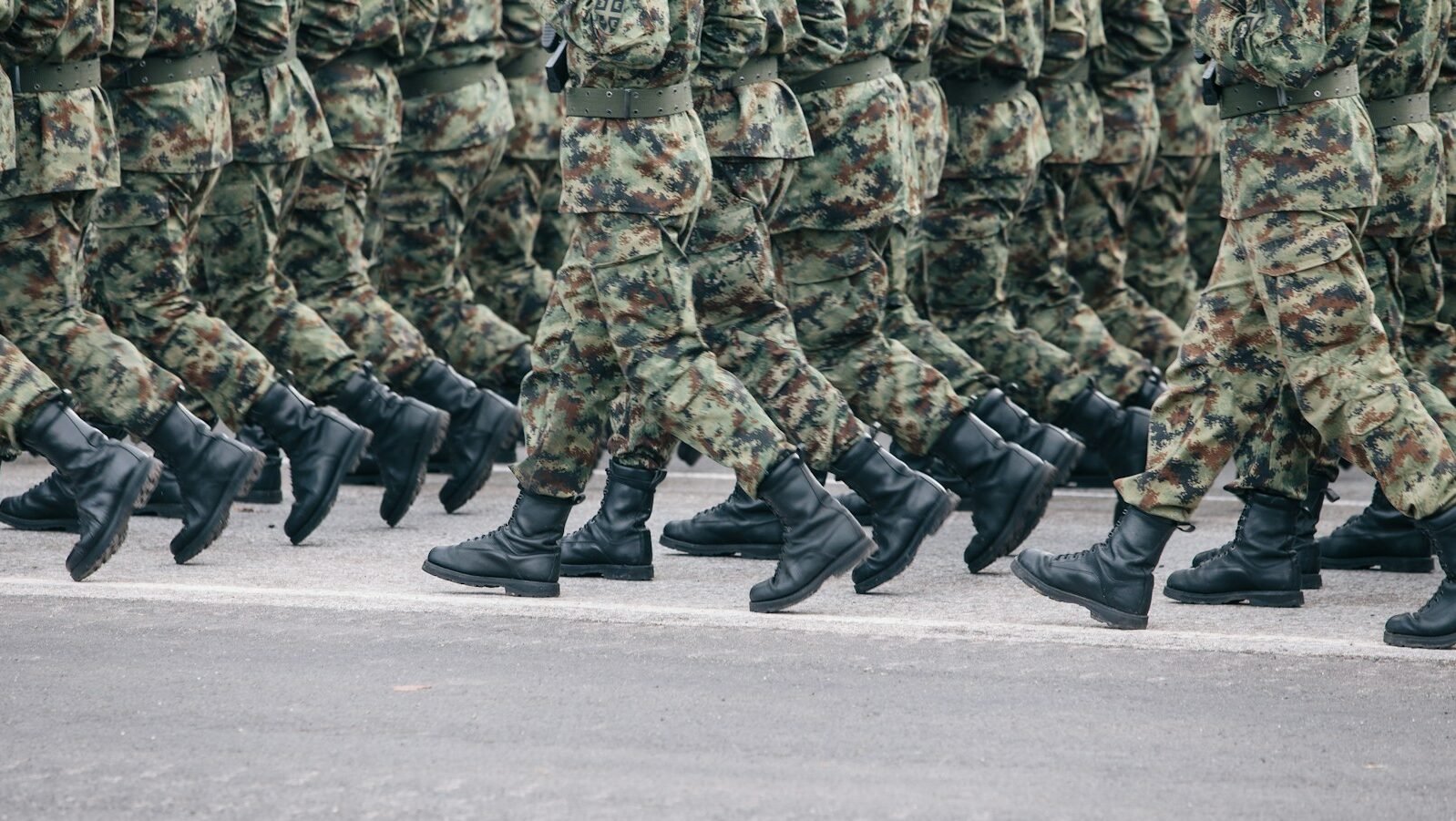 men in green and brown camouflage uniform